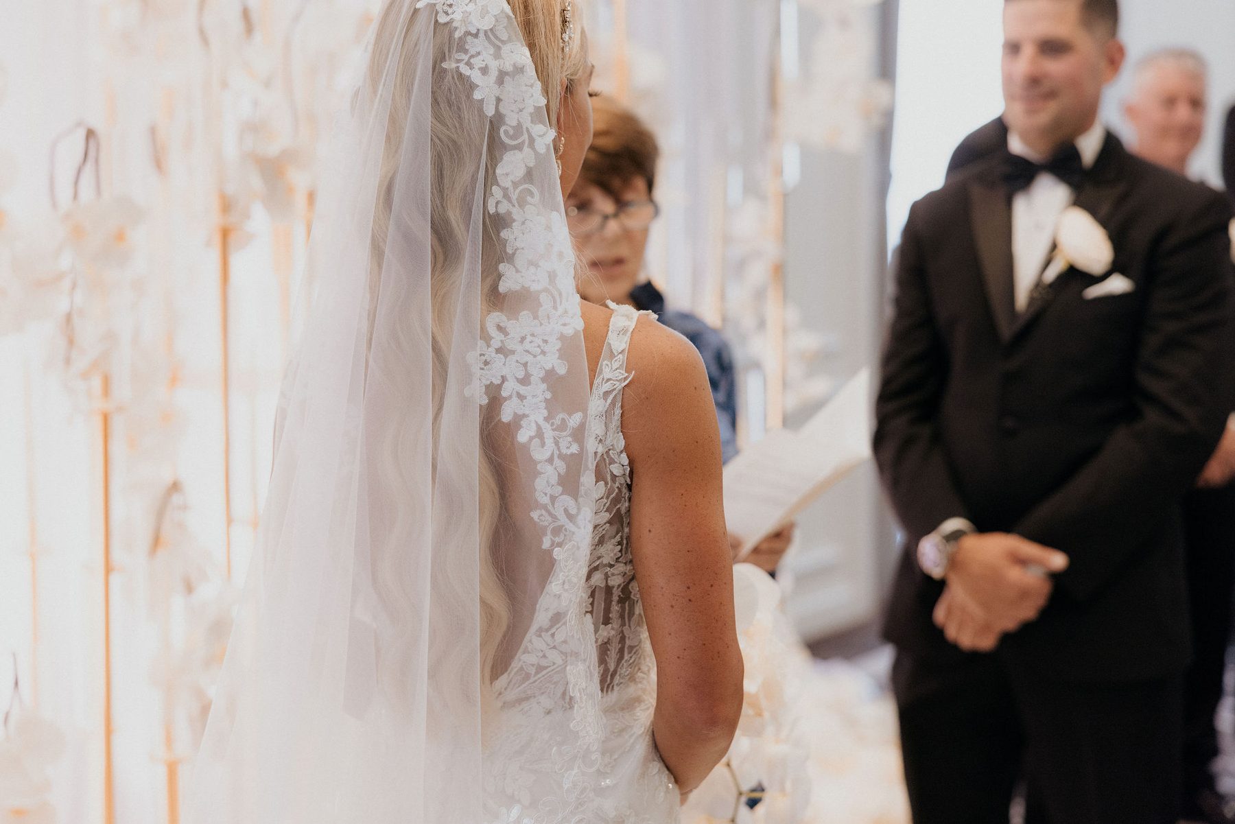 Groom seeing his bride for the first time as she reaches the altar