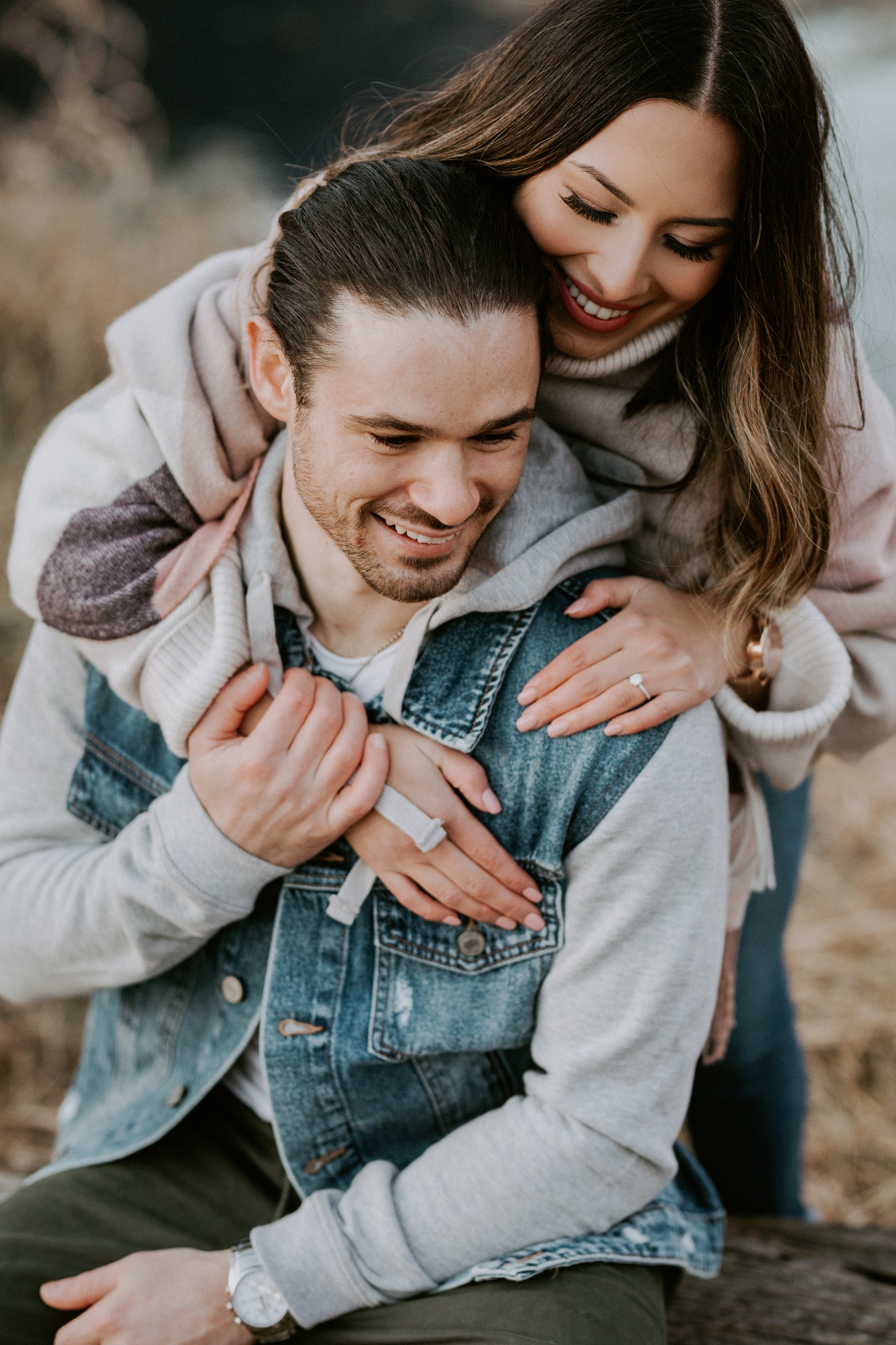 Engaged couple caught mid laugh