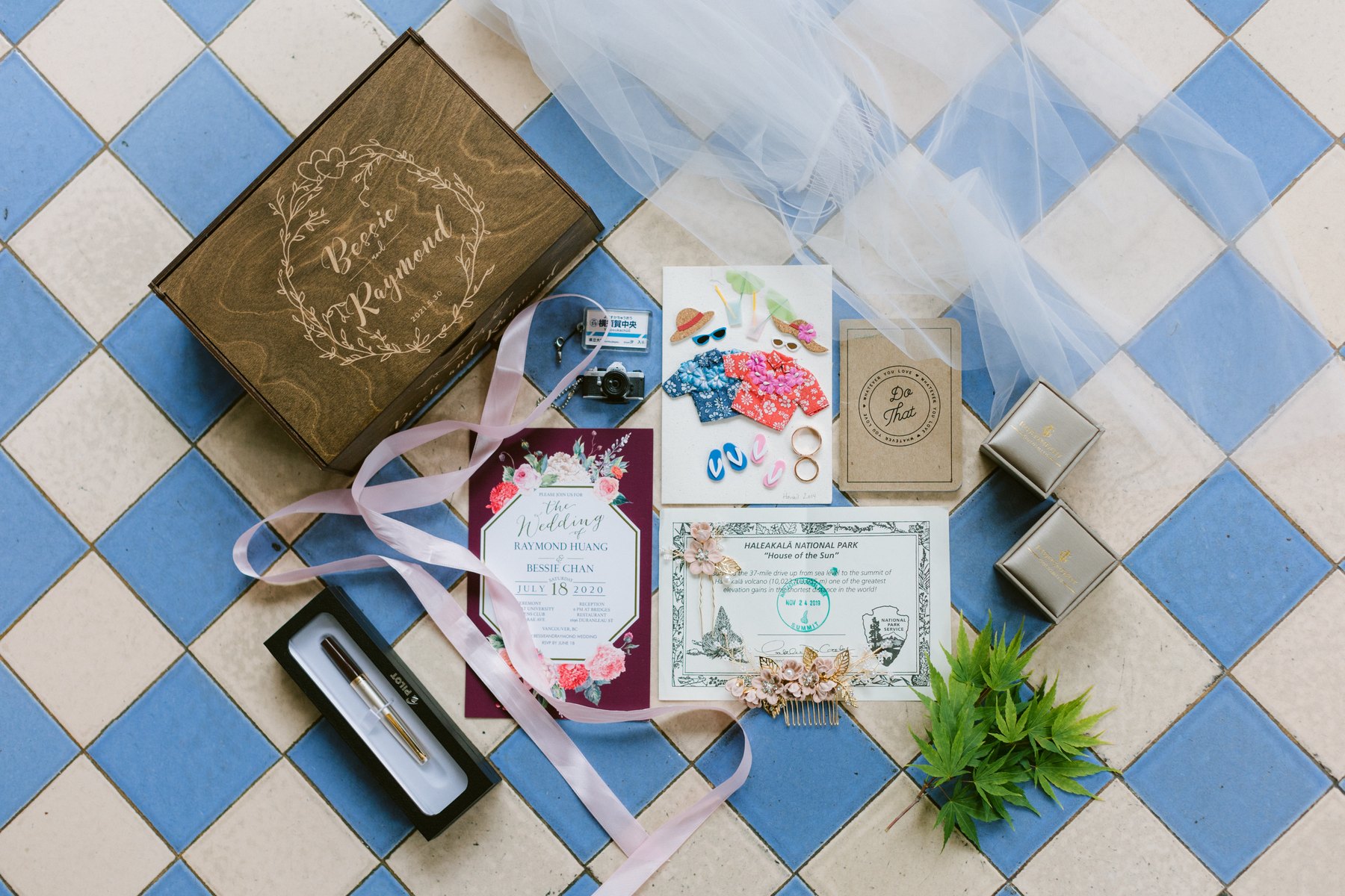 Invitation suite, ring boxes and florals laid out