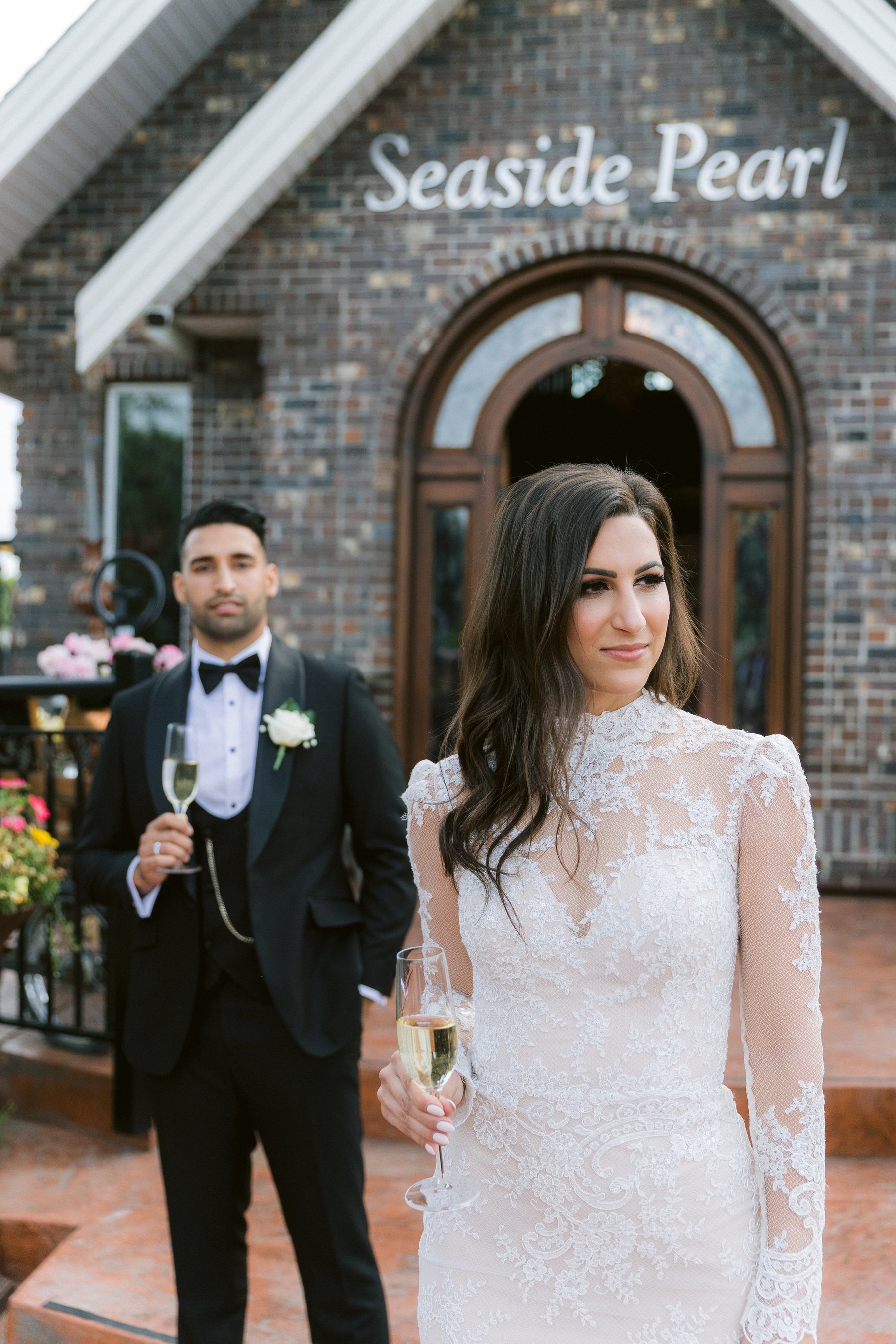 Bride and groom with a glass each after the ceremony