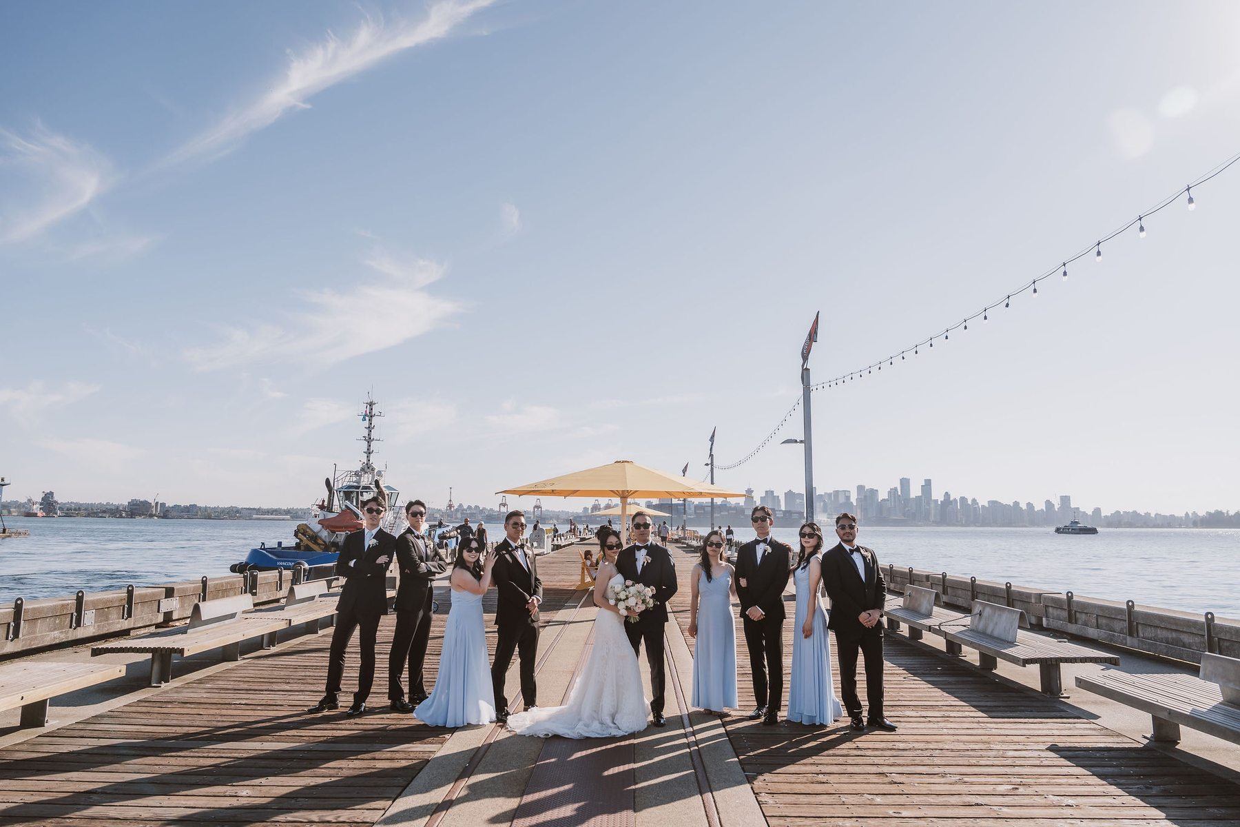 Wedding couple on the pier with Vancouver skyline