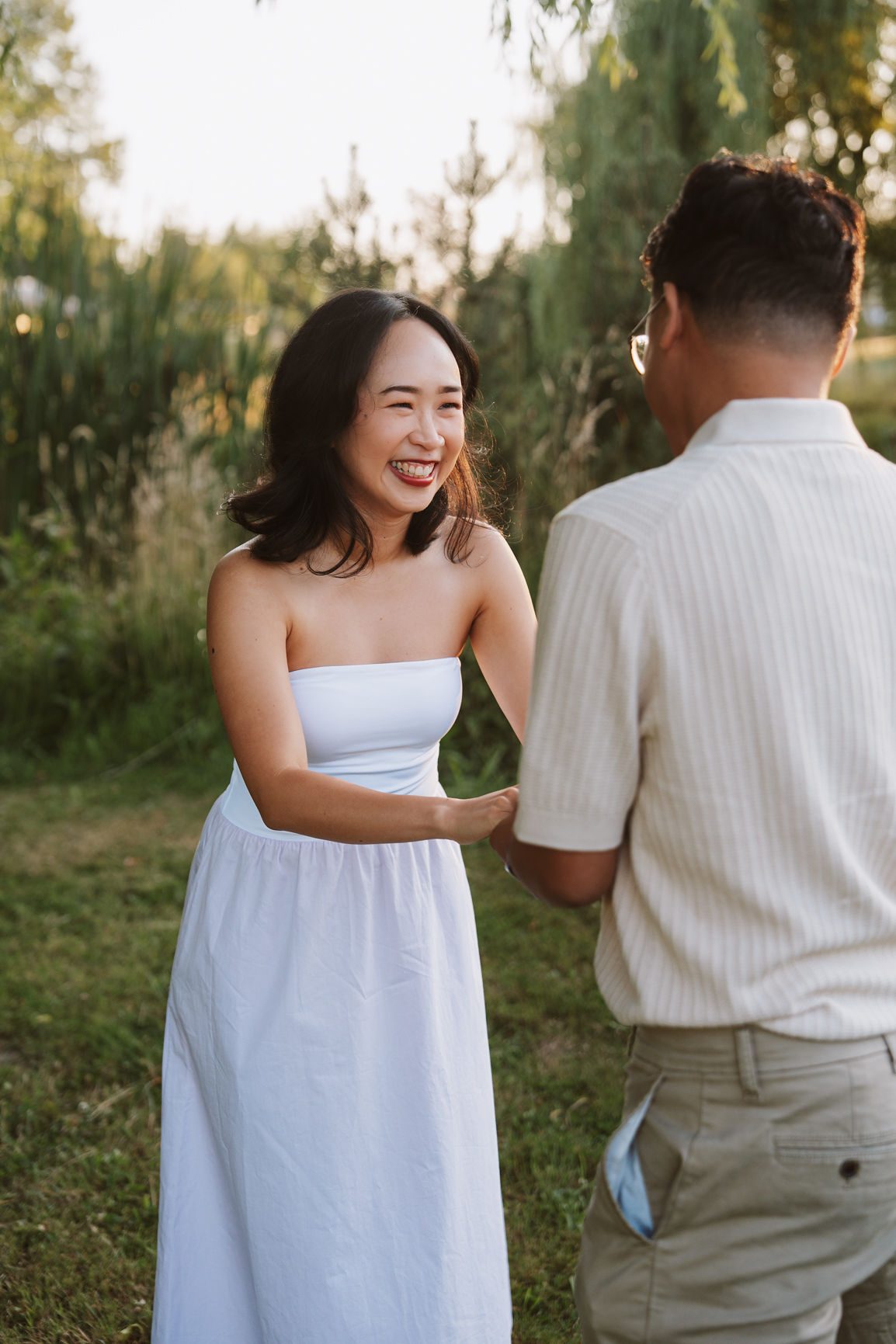 Couple laughing together in golden evening light